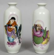 A pair of small Chinese porcelain vases Each decorated with a deity upon a cloud and with