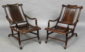 A pair of late 19th century Chinese hardwood moon gazing chairs Each shaped top rail above a