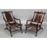 A pair of late 19th century Chinese hardwood moon gazing chairs Each shaped top rail above a