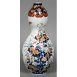 A 19th century Japanese porcelain double gourd vase Decorated in the Imari palette with floral