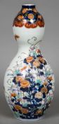 A 19th century Japanese porcelain double gourd vase Decorated in the Imari palette with floral