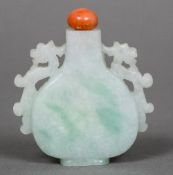 A Chinese jade snuff bottle Of flattened vase form with twin pierced dragon handle and coral