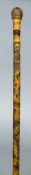 A late 19th/early 20th century Japanese bamboo walking stick Carved with a skeleton, a snake,