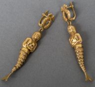 A pair of 19K gold ear pendants Each formed as a pair of entwined fish with an articulated mermaid