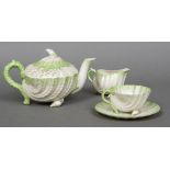 A second period Belleek Neptune part tea set Comprising: teapot and cover,