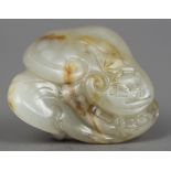 A Chinese carved russet jade group Worked with Lingzhi. 4 cm wide.