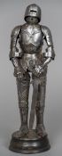 A miniature articulated model of a suit of armour With sword,