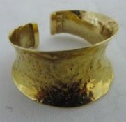 A gold Romanesque ring