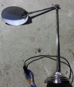 A chrome desk lamp