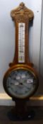 An oak cased barometer