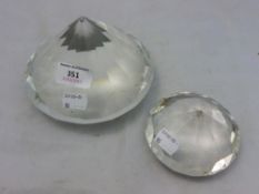 A pair of diamond formed paperweights