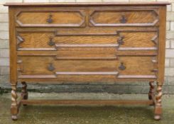 An early 20th century oak chest of drawers