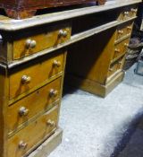 A Victorian oak pedestal desk