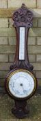 A Victorian oak barometer