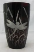 An etched glass vase decorated with dragonflies