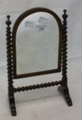 A Victorian rosewood and walnut miniature dressing table mirror