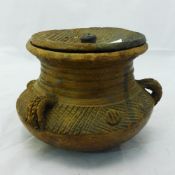 An African engraved pottery storage vessel