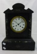 A Victorian black slate mantle clock