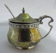 A silver mustard pot