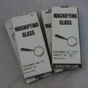 Four boxed magnifying glass