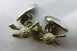 A pair of silver golfing cufflinks