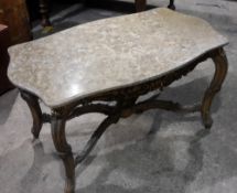 A marble topped gold coffee table