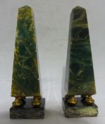 A pair of malachite obelisks on stands