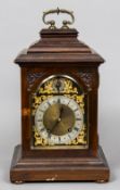 An early 20th century Georgian style mahogany bracket clock The scrolling loop handle above the