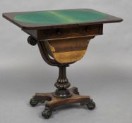An early 19th century rosewood games/work table The moulded rounded rectangular hinged revolving