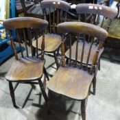 A set of four 19th century elm seated kitchen chairs