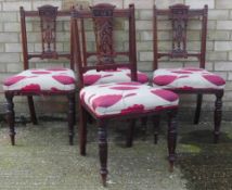 A set of four Edwardian walnut dining chairs