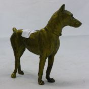 A small bronze model of a dog