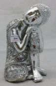 A silvered model of Buddha