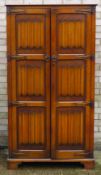 An Old Charm style linen fold wardrobe