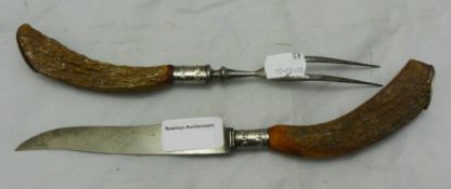 A pair of horn handled carvers