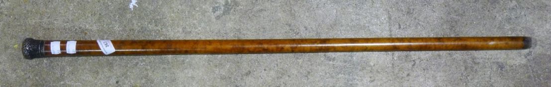 A silver topped walking stick