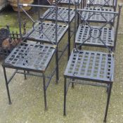 A set of eight wrought iron chairs