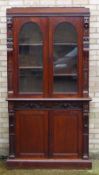 A Victorian carved oak bookcase/cabinet