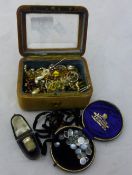 A quantity of costume jewellery in a glazed trinket box