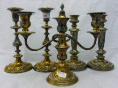 A silver plate candelabra and two pairs of candlesticks