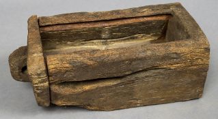 An early dug out wooden chest Of simple form, with losses and alterations. 92 cm long.