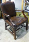 A leather upholstered mahogany open armchair