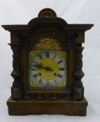 A Victorian walnut mantle clock