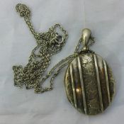 A Victorian silver locket on chain