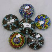 A set of six millefiori paperweights