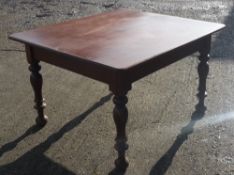 A mahogany topped table