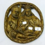 A religious carved wooden plaque