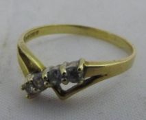 A gold stone set wishbone ring