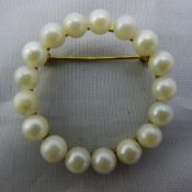 A gold and pearl brooch