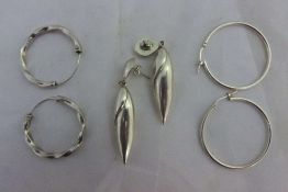 Three pairs of silver earrings